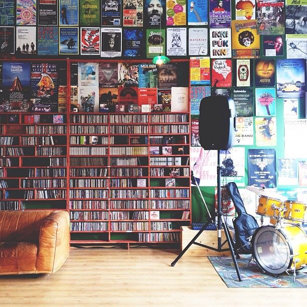 Picture of inside a music store with a guitar and speaker on the side.